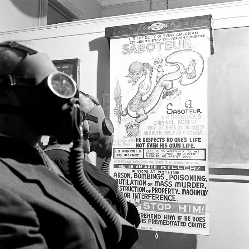 A poster at the Brooklyn Navy Yard calls for vigilance, December 1941.