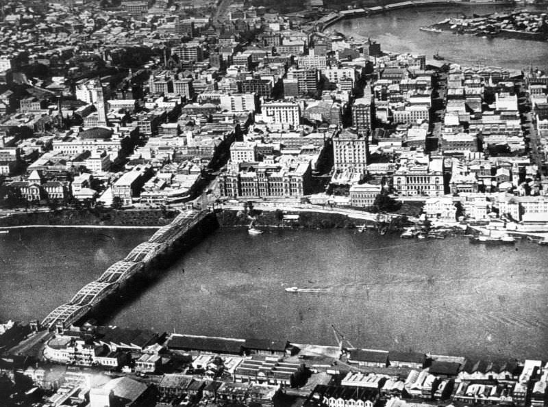 Aerial view of the Brisbane central business district showing Victoria Bridge and the Brisbane River, 1932