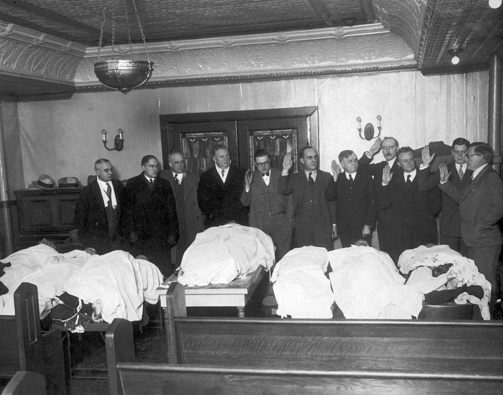 A special crime committee is sworn in over the bodies of the victims of the St. Valentine's Day Massacre, Chicago, 1929.