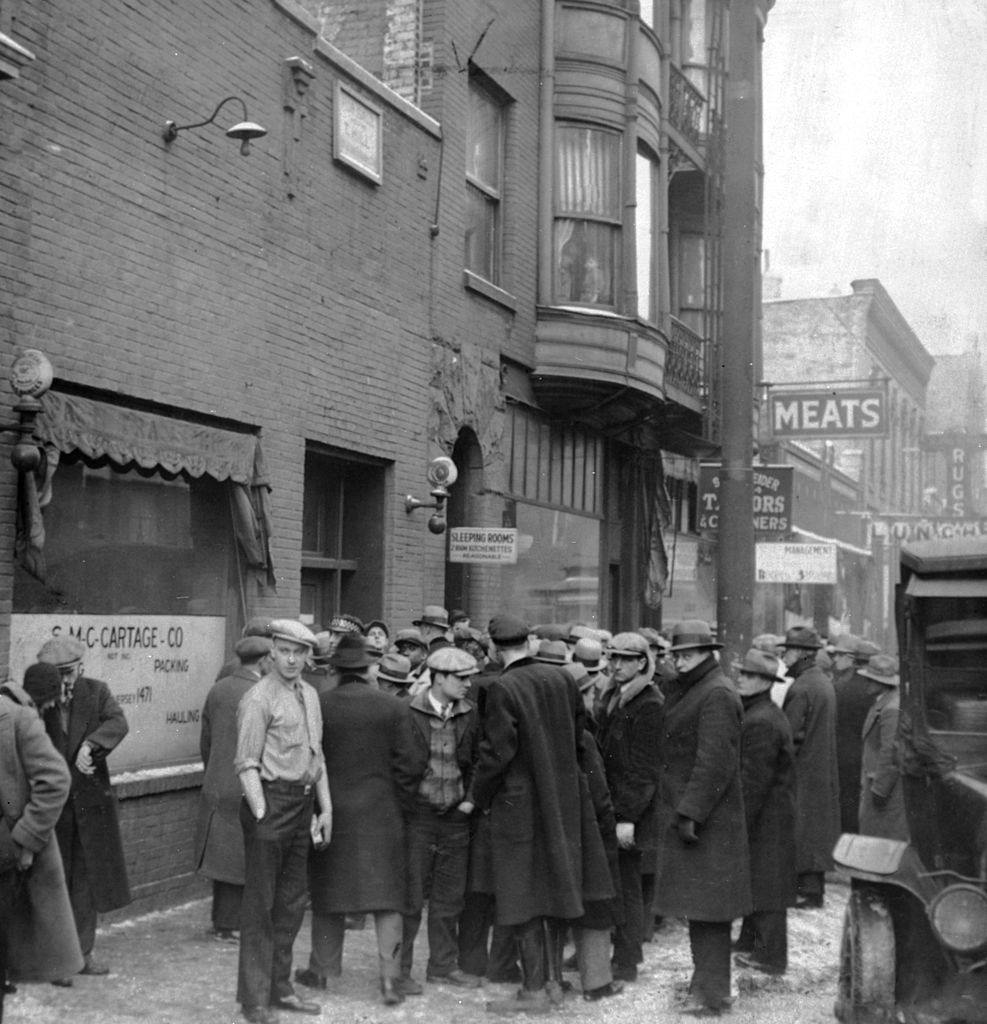 A crowd gathers outside the scene of the St. Valentine's Day Massacre, Chicago February 1929.