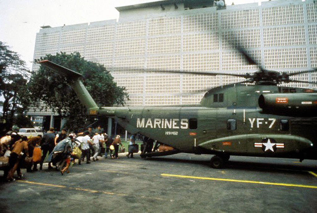 Civilian evacuees board US Marine helicopter inside US Embassy compound to be helilifted to the US Seventh Fleet ahead of Communist troops about to enter Saigon.