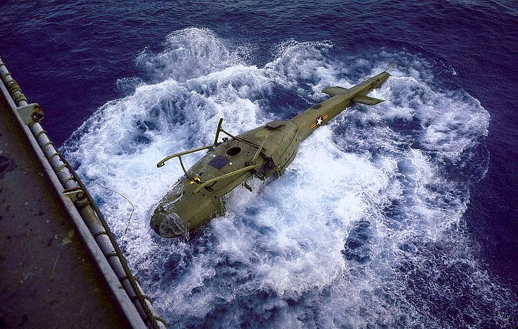 Vietnamese helicopter sinking after being dumped overboard from aircraft carrier to make more room for the evacuation of American personnel from Vietnam during the fall of Saigon.