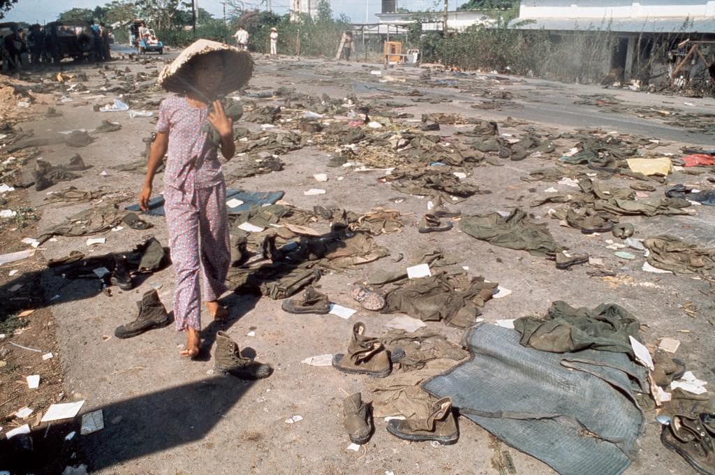 Abandoned uniforms of South Vietnamese soldiers lie on the road after the invasion of North Communist troops which led to the Fall of Saigon.