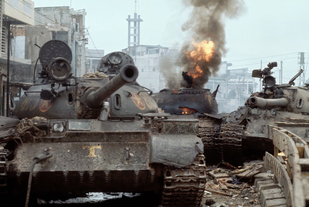 South Vietnamese [sic] tank in flames as North Vietnamese forces enter Saigon.