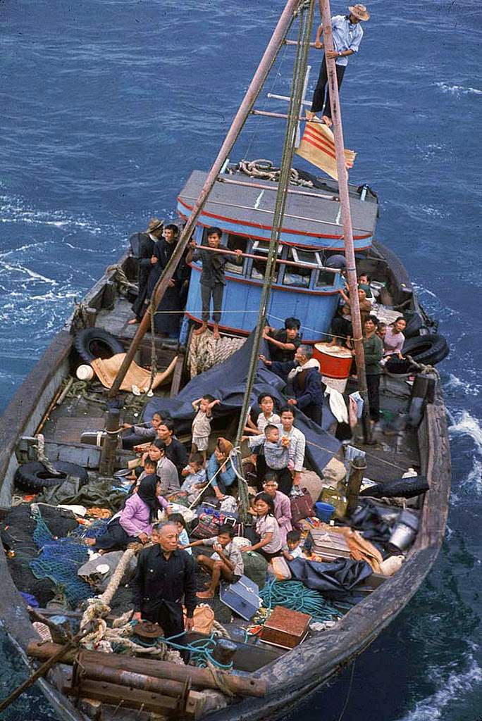 South Vietnamese refugees approach a U.S. war ship to seek refuge from the invading force from the North April 1975 in the South China Sea near Saigon.