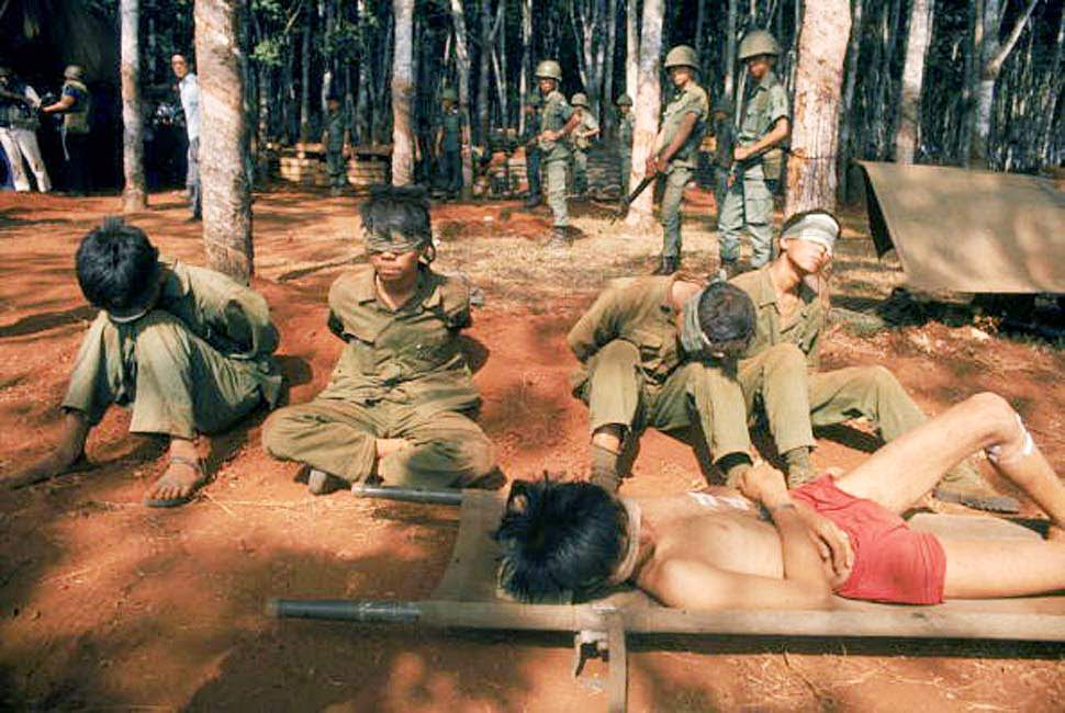 North Vietnamese troops are blindfolded and held under guard April 1975 in Saigon.