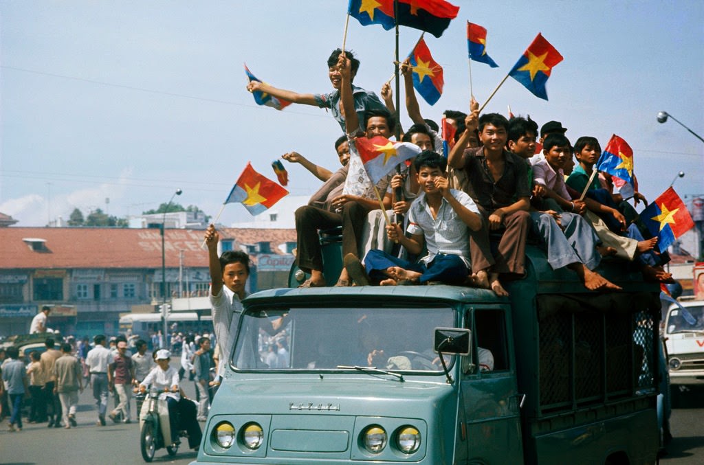 Vietnamese celebrate after the fall of Saigon.