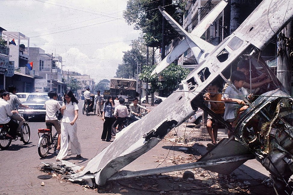 Saigon ( Vietnam's ) fall. Wreck of an airplane in a street. April 30, 1975.