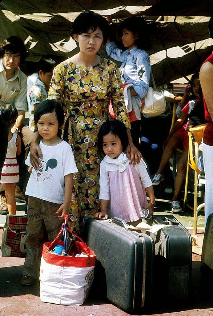 As Saigon falls to the communist rule of North Vietnamese, a Vietamese family await evacuation April, 1975 in Saigon, Vietnam.