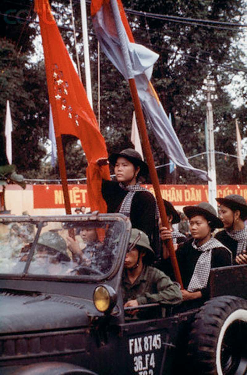 Female North Vietnamese troops enter Saigon in a jeep.