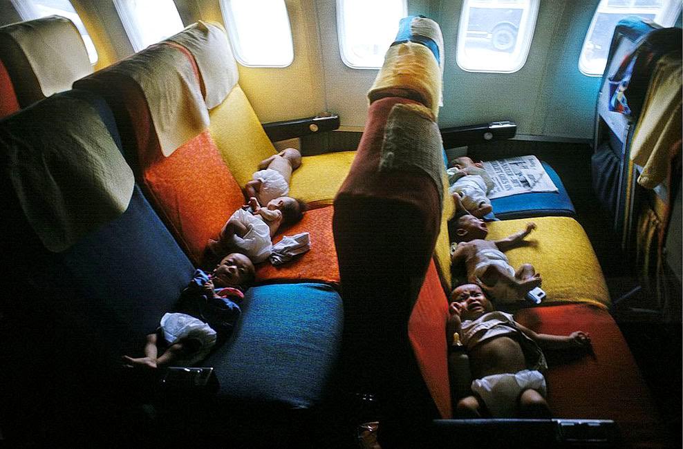 South Vietnamese babies on a flight from Saigon to the USA (probably San Francisco) during Operation Babylift.