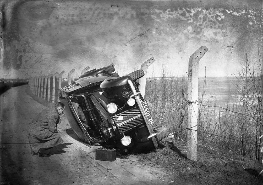 An officer observing a car, 1940s.