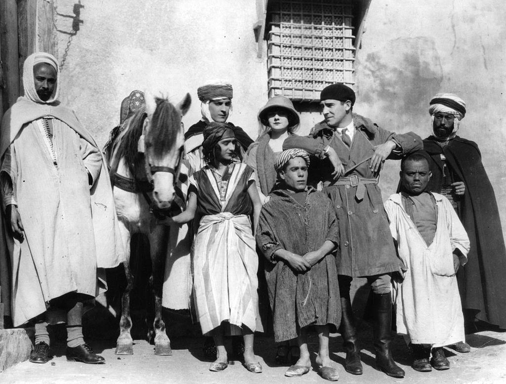 Alice Terry with Rex Ingram, Ramon Novarro and a group of native actors during the filming of 'The Arab', 1924.