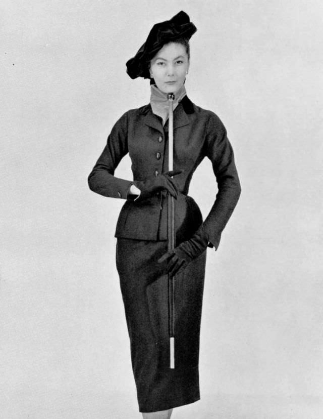 Alla in elegant blue-violet suit with velvet lapels by Christian Dior, velvet Henry VIII beret completes the look, 1951