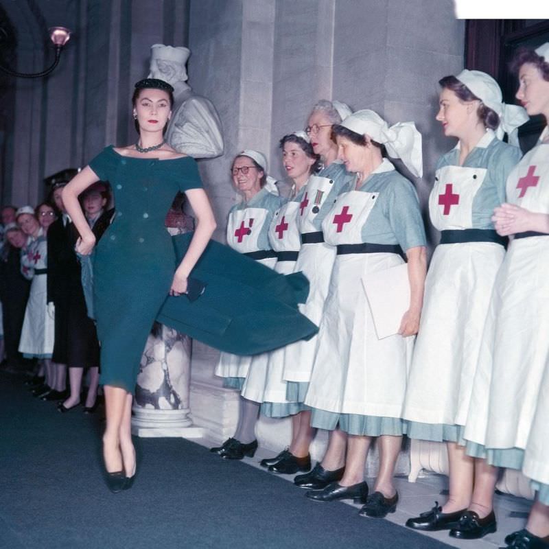 Alla delights British Red Cross nurses in a creation by Christian Dior during the presentation of his Winter Collection at Blenheim Palace in aid of the British Red Cross, November 3, 1954