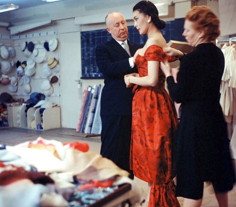 Dior and his seamstress adjust gown on Alla, photo by Loomis Dean, Paris, 1957