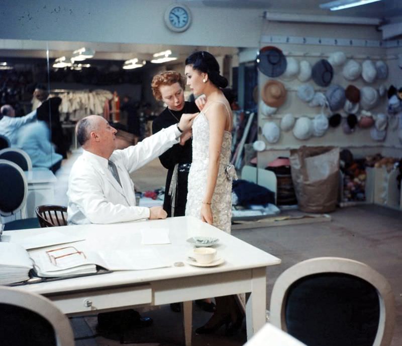 Dior and his seamstress adjusting a gown on Alla, photo by Loomis Dean, Paris, 1957