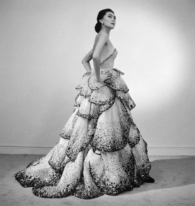Alla is wearing Christian Dior's petaled evening gown called "Junon" named for the queen of the gods in Roman mythology, p1949