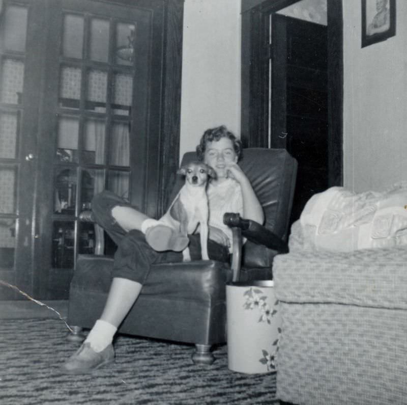 Girl sitting in chair with dog