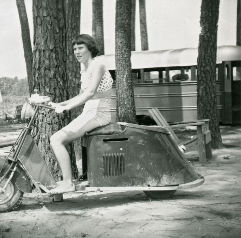 Teenage girl on motor scooter