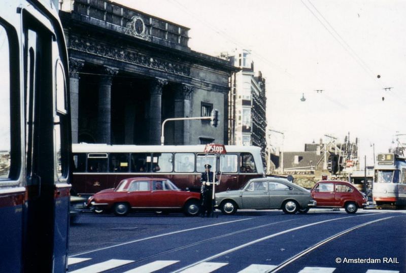 The traffic police in control of cars during rush hour, Haarlemmerplein, Amsterdam, January 1973