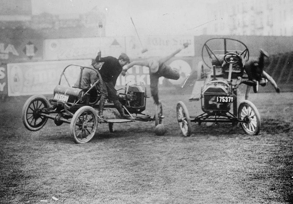 Cars carry mallet wielding Competitors in a Game of Polo in an arena on Coney Island, New York, 1900s.