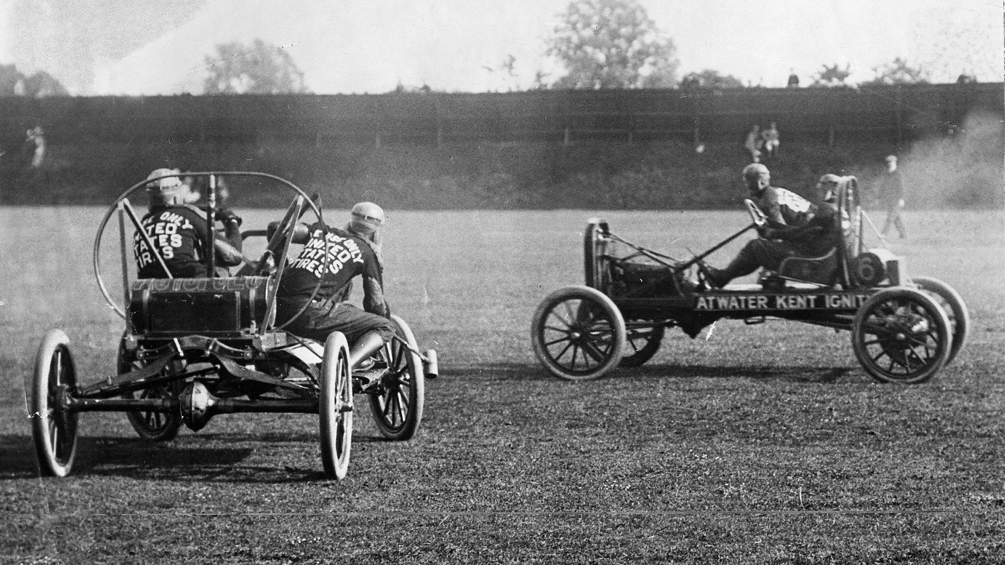 Auto poloists in cars during a match.