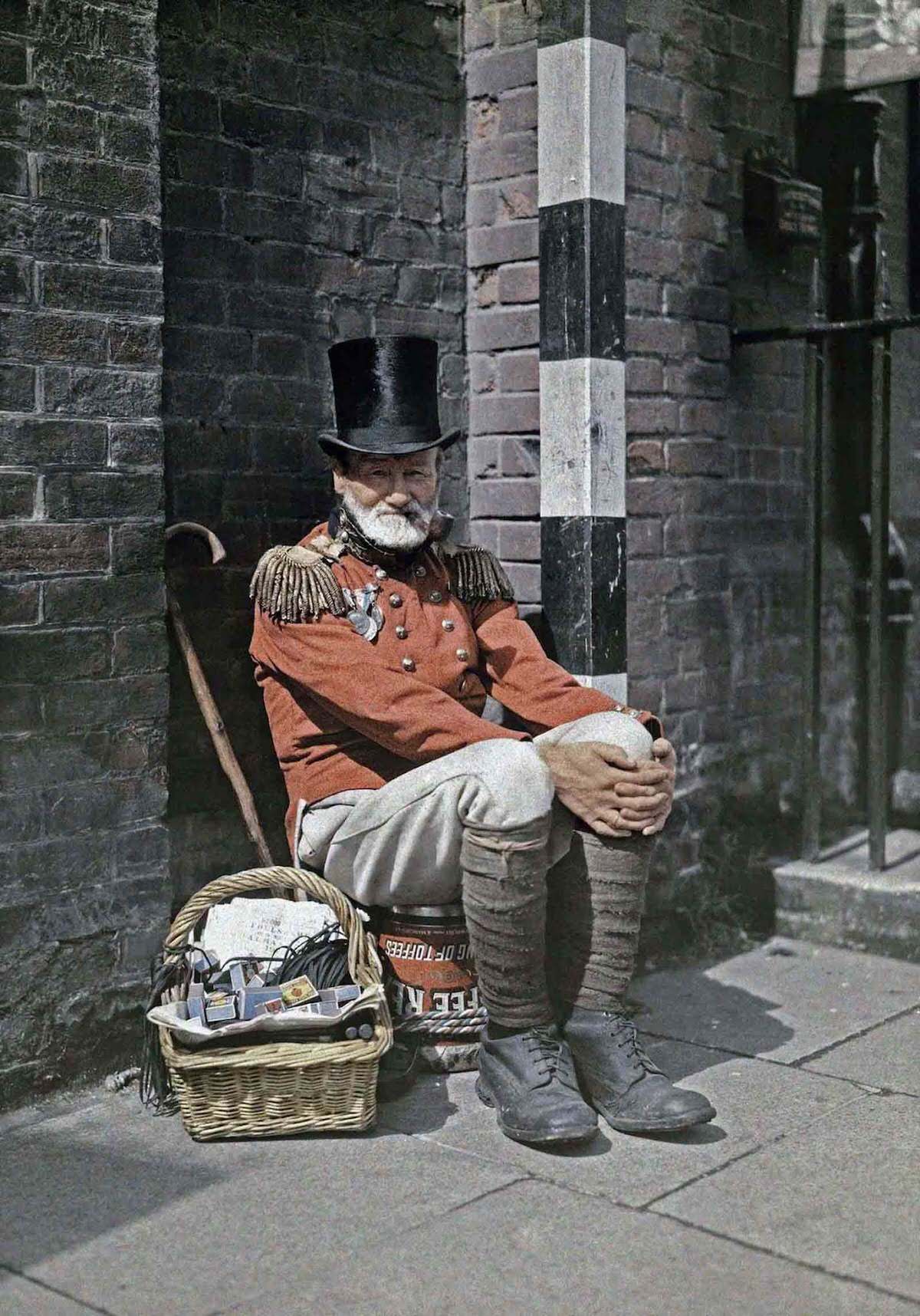 A war veteran sells matches on the street, in Canterbury, Kent.