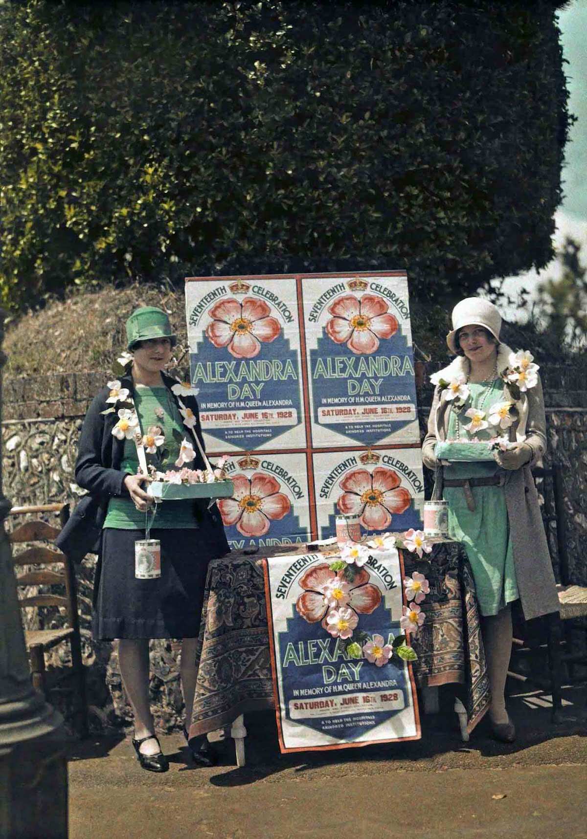 Women selling Queen Alexandra roses for charity, in Seaford, East Sussex.