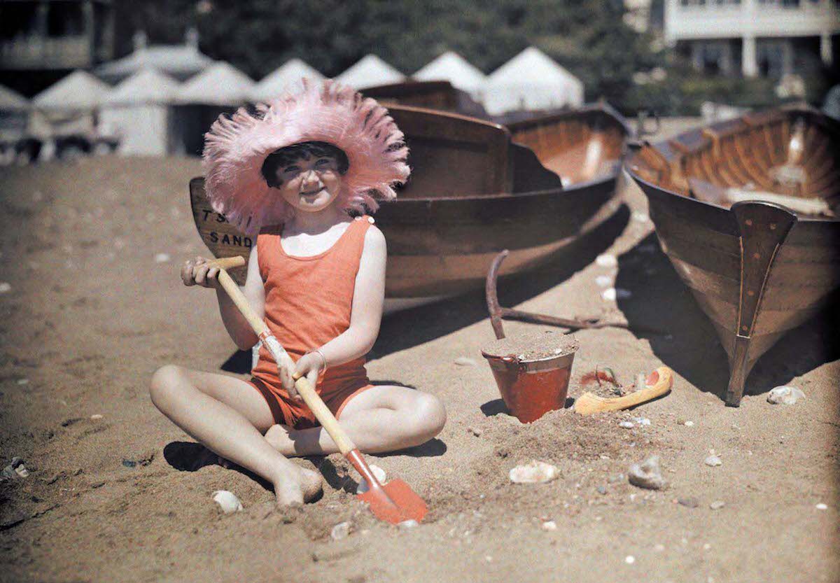 A young girl plays in the sand at Sandown, Isle of Wight.