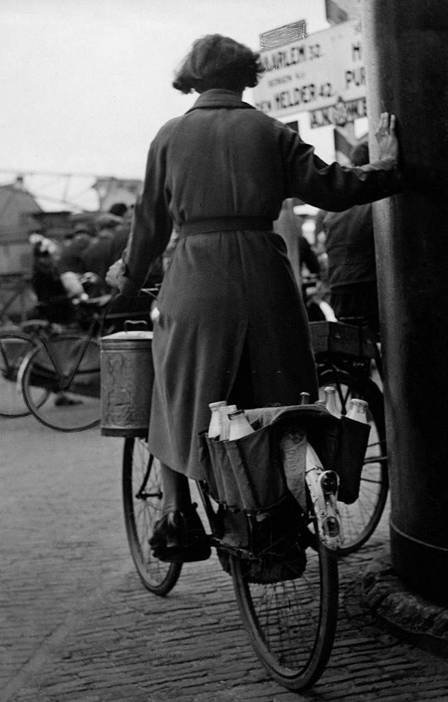 Woman with groceries on a bicycle in Amsterdam, 1938.