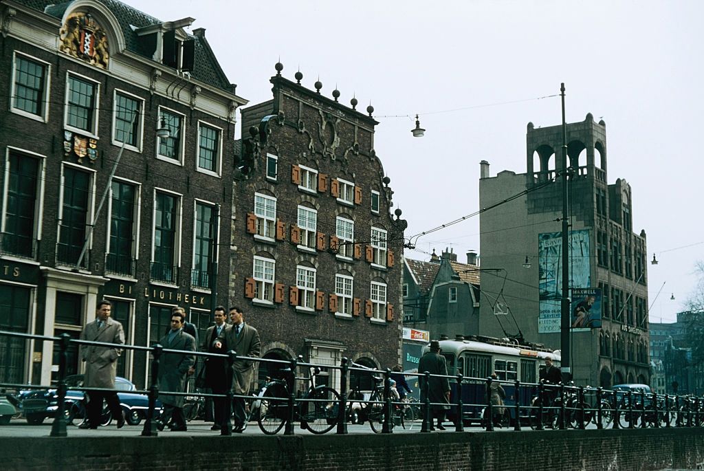 A street by a canal in Amsterdam with bicyles, 1965.