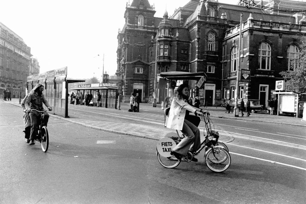 Cyclist in an Amsterdam street deserted by cars, during fuel shortages caused by the first oil shock, 1973.