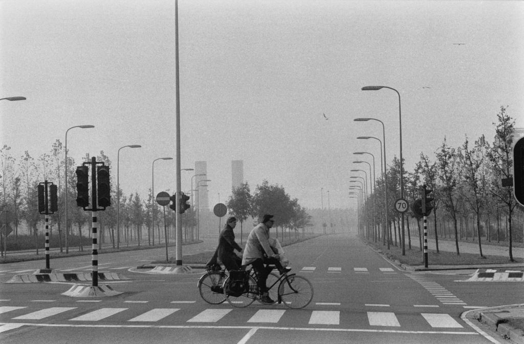 Cyclist in an Amsterdam street deserted by cars, during fuel shortages, 1973.