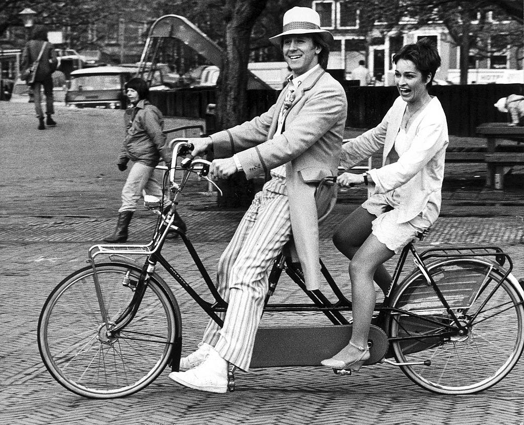 Peter Davison and Janet Fielding  riding round Amsterdam, 1982.