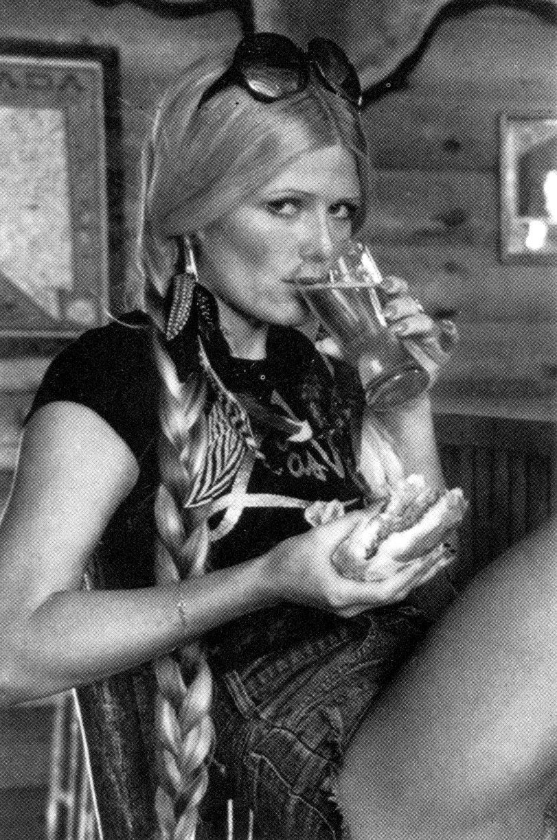Debra Jo Fondren enjoying her burger and beer, 1970s.
