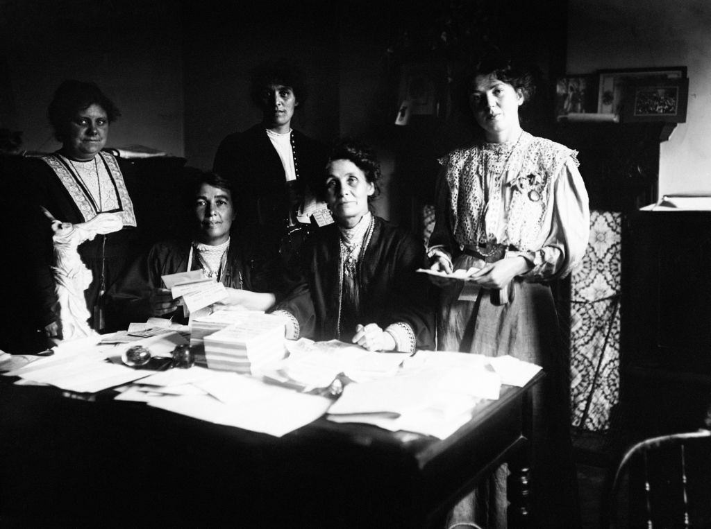 Emmeline Pankhurst (second right) with her daughter Christabel and other suffragette leaders at a meeting at Clements Inn in 1908.