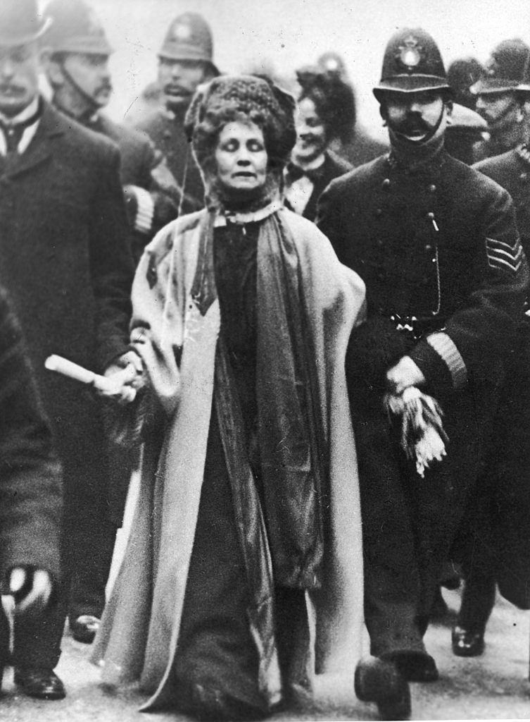Emmeline Pankhurst surrounded by police officers, 1900.