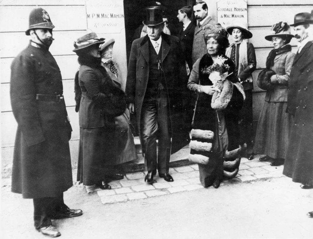 Emmeline Pankhurst leaves the court at Epsom with James Murray, a former member of parliament who stood bail for her.