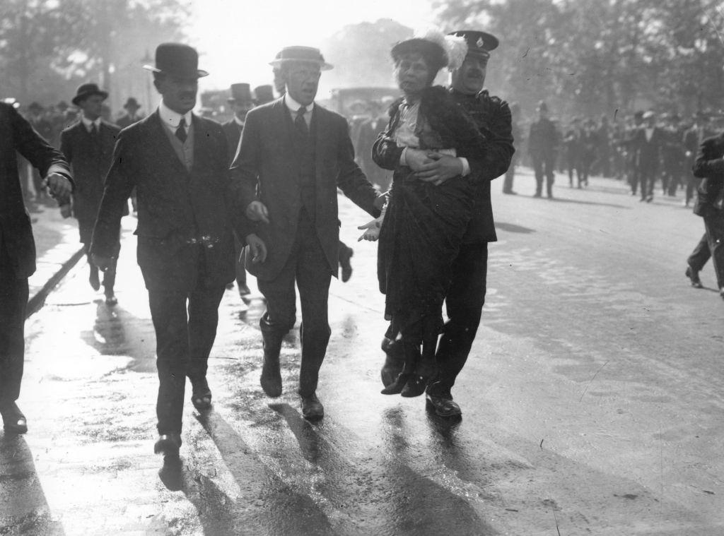 Emmeline Pankhurst is arrested and carried away by Superintendent Rolfe at a march, organised by Pankhurst, to petition King George V, London, 21st May 1914.