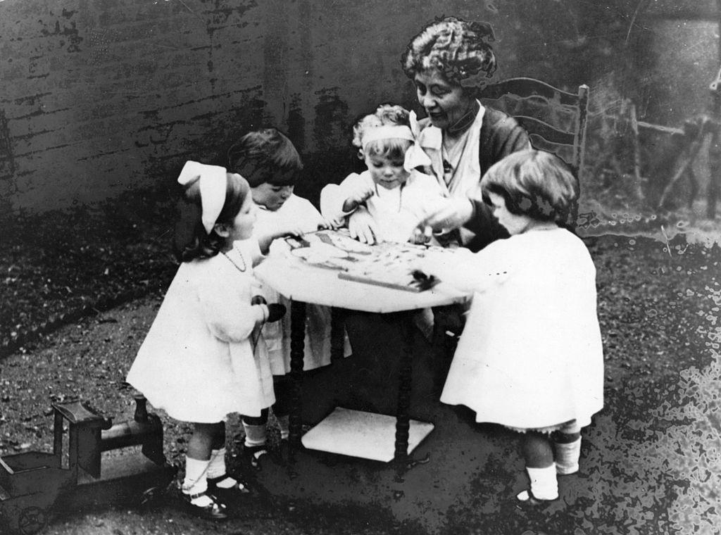 Emmeline Pankhurst with the four war orphans whom she adopted, 1915.