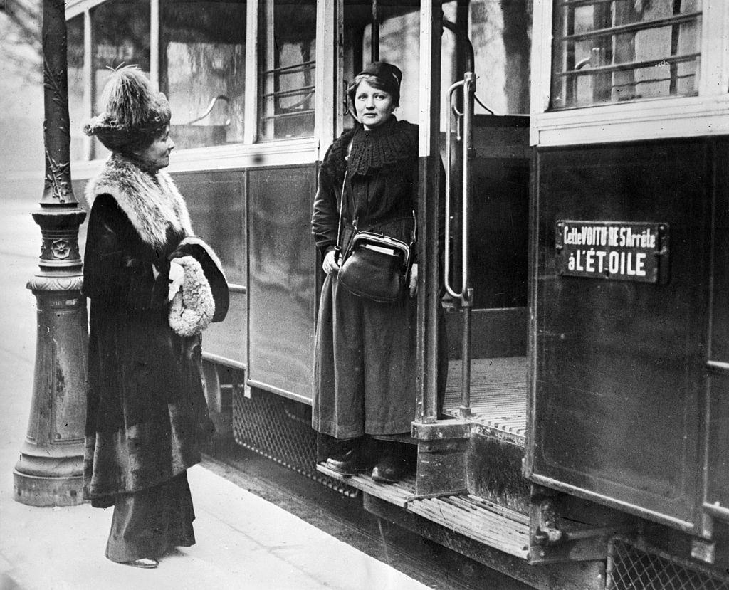 Emmeline Pankhurst talking to one of the women street car conductors.