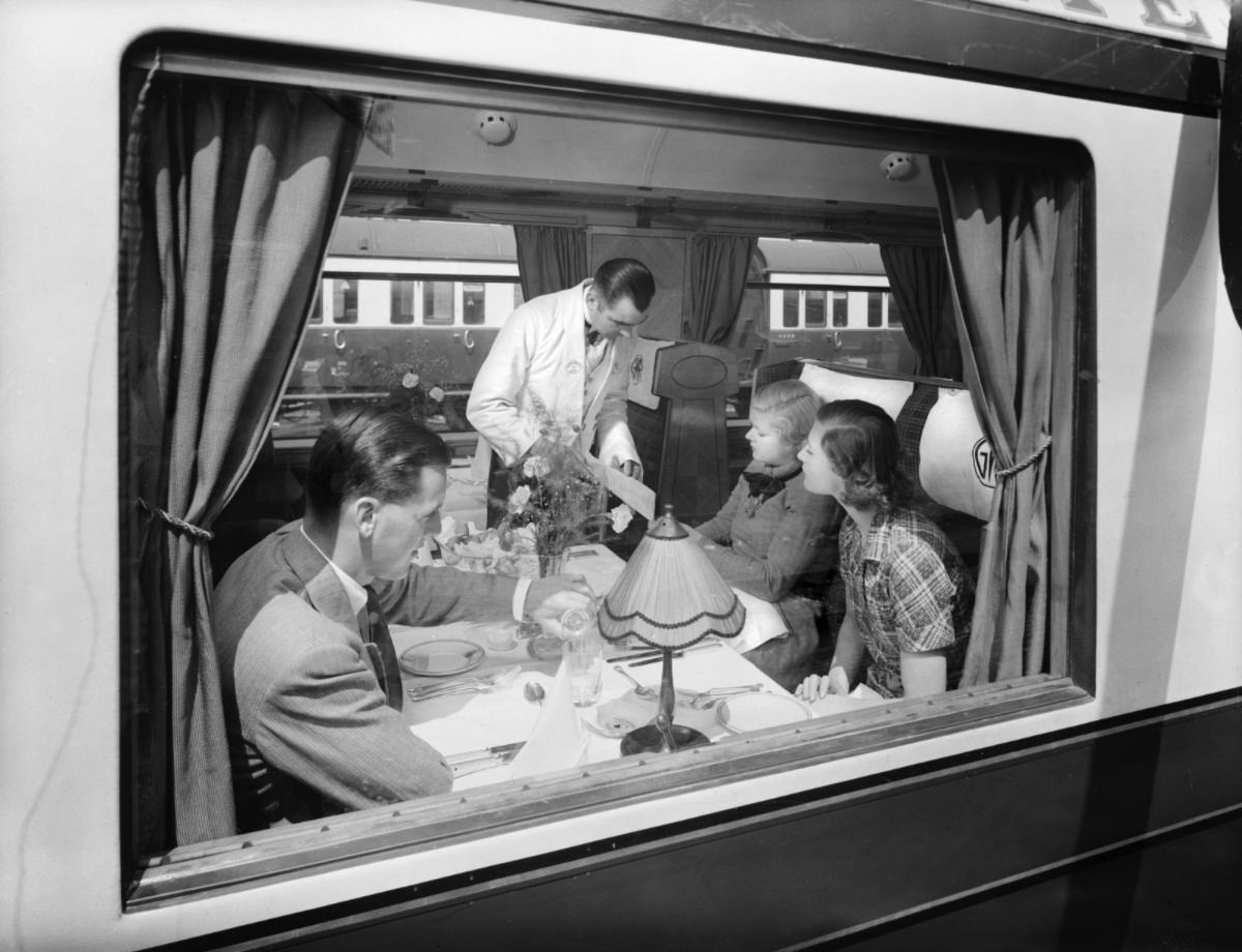 Passengers in a first class Great Western Railway dining car.