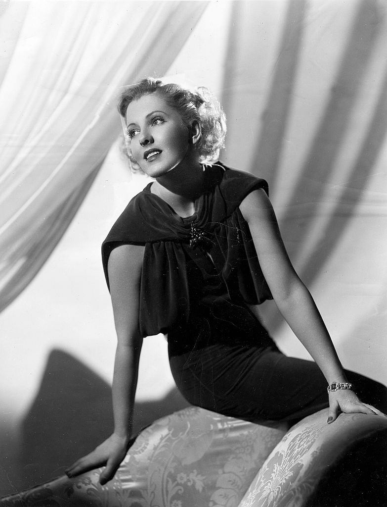 Jean Arthur sitting on the sofa, 1937.