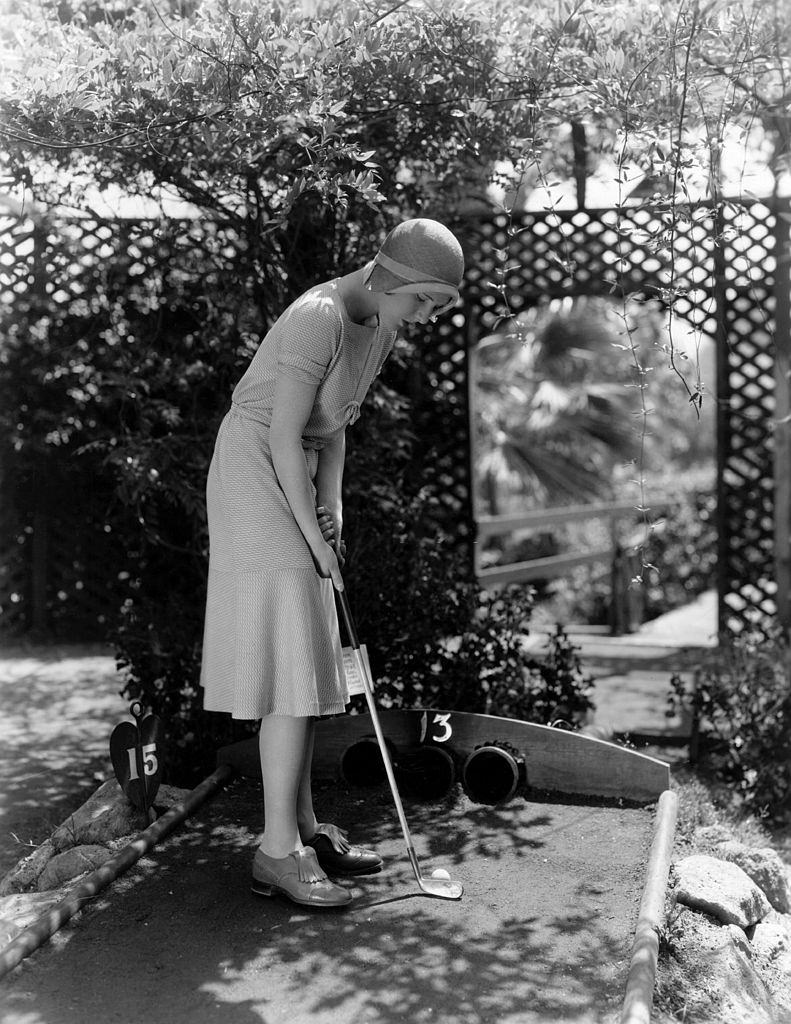 Jean Arthur indulges in a round of miniature golf, 1930.