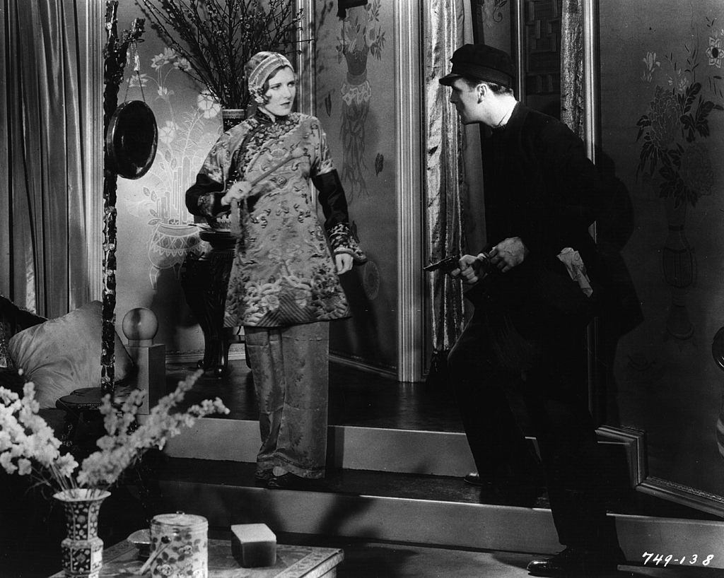 Jean Arthur with Neil Hamilton in an action scene from the film 'The Insidious Dr Fu Manchu', 1931.