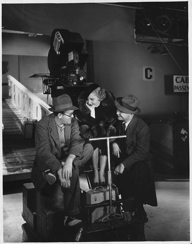Jean Arthur and actor Edward G. Robinson between scenes of 'The Whole Town's Talking.', 1935.