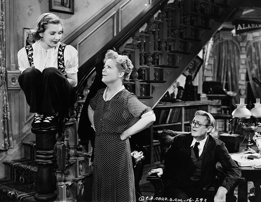 Jean Arthur as granddaughter Alice Sycamore, Spring Byington as daughter Penny Sycamore, and Lionel Barrymore as Grandfather Martin Vanderhof in the 1938 movie 'You Can't Take It with You'.