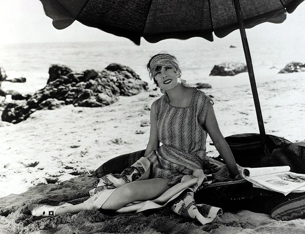 Jean Arthur relaxing on the beach, 1930.