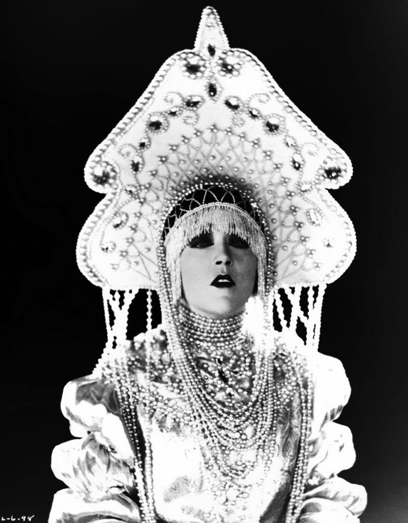 Mae Murray in costume as Olga Farinova in a still from the movie 'Fashion Row', 1923.